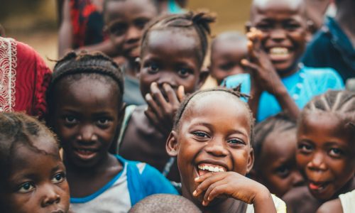 children smiling at camera and laughing